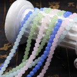 Floral glass beads in jade effect in 4mm